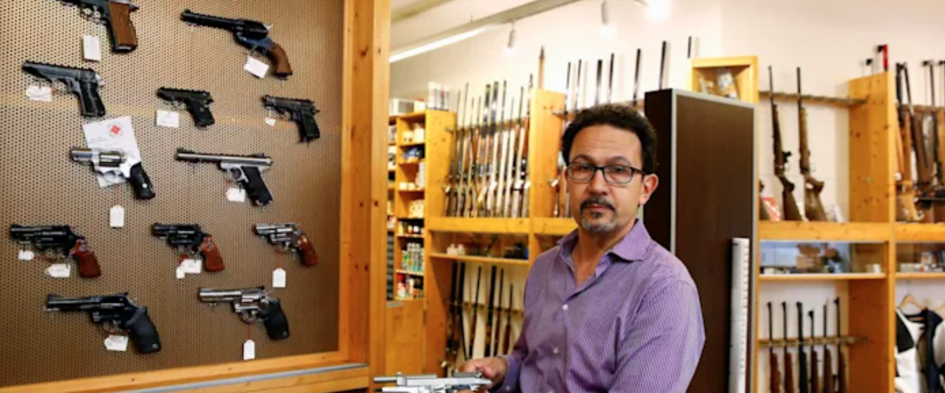 Daniel Wyss, the president of the Swiss weapons-dealers association, in a gun shop.REUTERS/Arnd Wiegmann