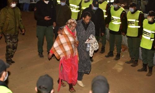 Rayan's parents leaving the scene after their son's body is taken away by ambulance - الصورة نقلا عن بي بي سي 